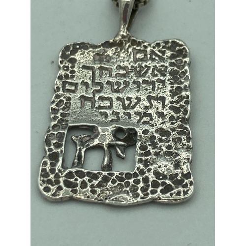 132 - SILVER CHAI PENDANT mounted on a SILVER BOX CHAIN , having the CHAI in open work  with Hebrew wordin... 