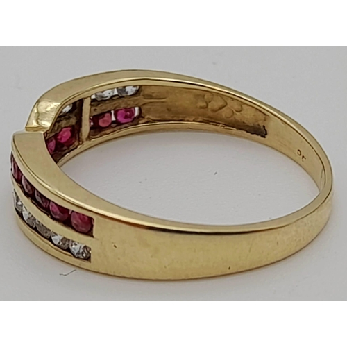 219 - A 9 K  yellow gold ring with rubies and diamonds in a cross over design. Size: n, weight: 1.9 g.