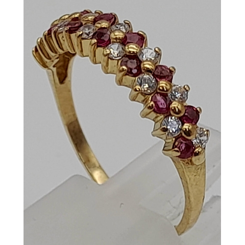 226 - A 9 K yellow gold ring with rubies and diamonds. Size: Q, weight: 2 g.