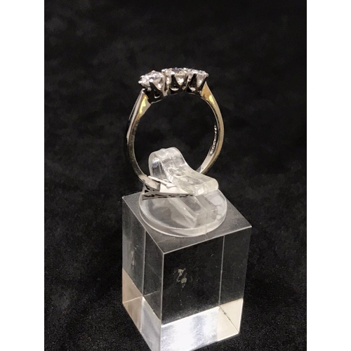 61 - 18ct gold three diamonds ring of one carat diamonds in total and hallmarked for Sheffield with maker... 