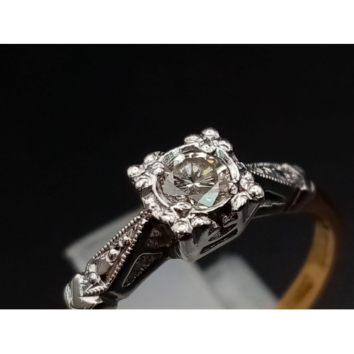 2 - An Illusion set 0.33 carat diamond ring set with diamond shoulders. This is set in 18ct yellow gold ... 