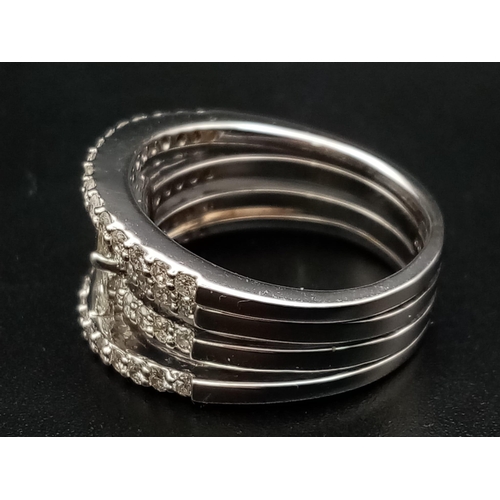 241 - This is the ultimate in a cocktail stacking ring, it is designed with natural diamond baguettes in t... 