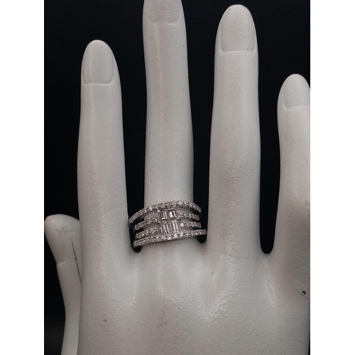 241 - This is the ultimate in a cocktail stacking ring, it is designed with natural diamond baguettes in t... 