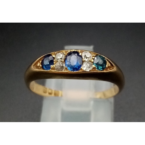 247 - An 18ct yellow gold slim band with three sapphires alternate between double set diamonds,  ring size... 