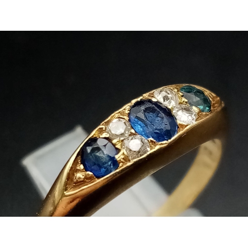 247 - An 18ct yellow gold slim band with three sapphires alternate between double set diamonds,  ring size... 