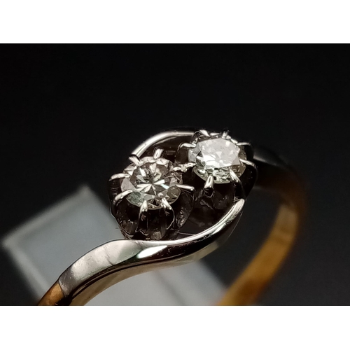 30 - A two stone diamond crossover ring set in 18ct yellow gold and platinum head, 0.5ct diamonds. Ring s... 