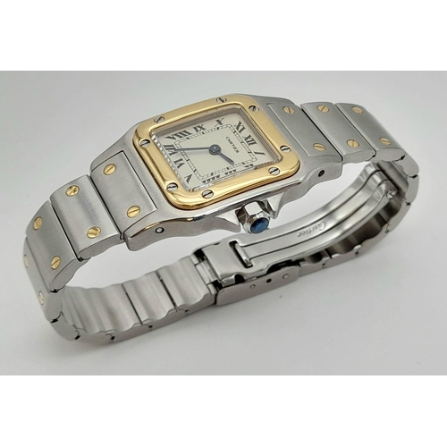 305 - A LADIES GOLD AND STEEL CARTIER WRISTWATCH WITH QUARTZ MOVEMENT. 24mm