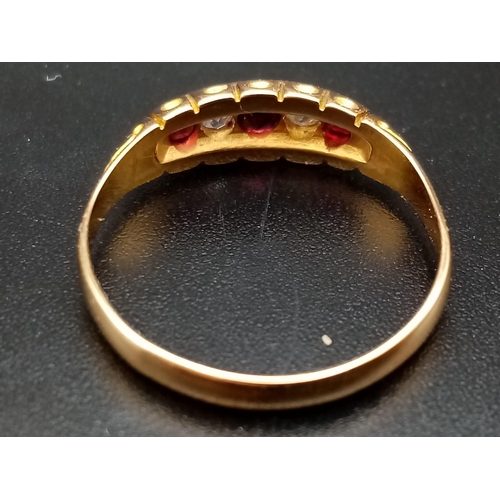 346 - An 18ct yellow gold three rubies and two diamonds ring, size M 1/2, total weight 2.40 grams