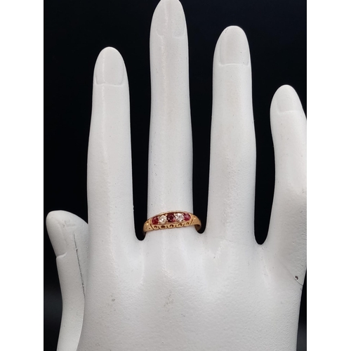 346 - An 18ct yellow gold three rubies and two diamonds ring, size M 1/2, total weight 2.40 grams