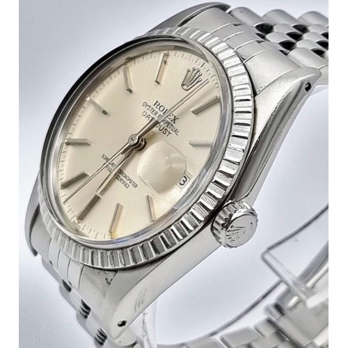 59 - A Rolex Oyster Perpetual Datejust Gents Watch. Stainless steel strap and case - 36mm. Silver tone di... 