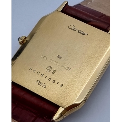 87 - A Cartier Santos 18K Gold Cased Ladies Quartz Tank Watch. Brown leather strap. Case - 35 x 27mm. In ... 