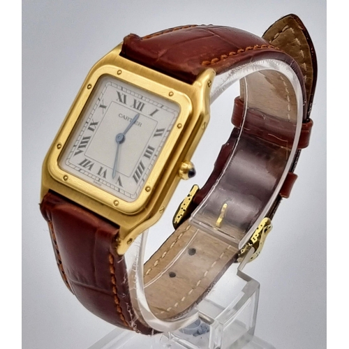 87 - A Cartier Santos 18K Gold Cased Ladies Quartz Tank Watch. Brown leather strap. Case - 35 x 27mm. In ... 