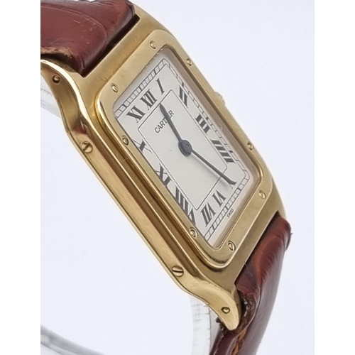 87 - A Cartier Santos 18K Gold Cased Ladies Quartz Tank Watch. Brown leather strap. Case - 35 x 27mm. In ... 