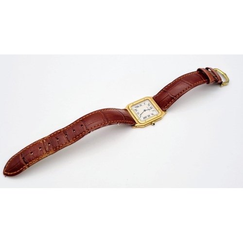 87 - A Cartier Santos 18K Gold Cased Ladies Quartz Tank Watch. Brown leather strap. Case - 35 x 27mm. In ... 