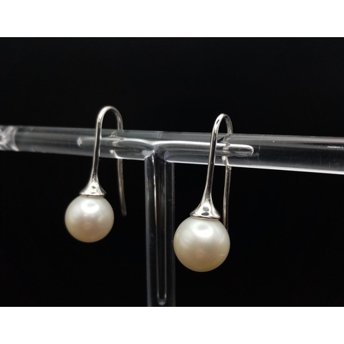 9 - 7mm Pearl drop earrings on 18 carat white gold fish hooks very unique and totally classic in design,... 