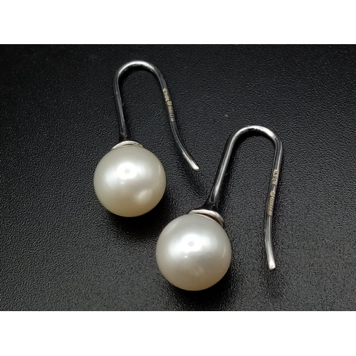 9 - 7mm Pearl drop earrings on 18 carat white gold fish hooks very unique and totally classic in design,... 