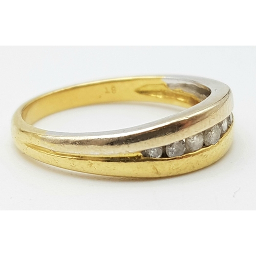 318 - An 18 K yellow gold band ring with diamonds. Size: M, weight: 3.3 g.