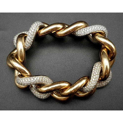 319 - a very heavy yellow and white gold bracelet with 17.5ct diamonds.   132.1gms