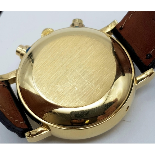 402 - A BUCHERER 18K GOLD MOONPHASE WATCH WITH 3 SUB-DIALS ON A LEATHER STRAP.  38mm