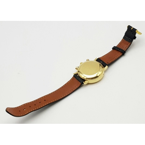 402 - A BUCHERER 18K GOLD MOONPHASE WATCH WITH 3 SUB-DIALS ON A LEATHER STRAP.  38mm