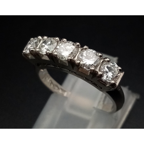 18 - A platinum 800 ring with five diamonds (total 1 carat). Ring size: K, weight: 5.7 g.