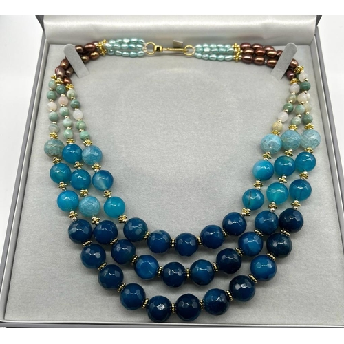 180 - A Three-Row Shades of Blue Faceted Agate Necklace with Multi-Coloured Cultured High Lustre Seed Pear... 