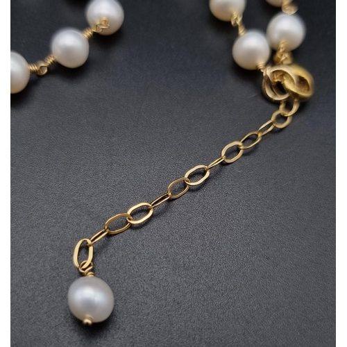 275 - A wire wrapped row of 32 inches cultured pearls.