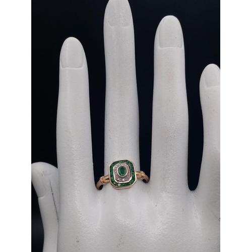 311 - An Art Deco 9 K yellow gold ring with emeralds and diamonds. Ring size: R, weight: 2.1 g.