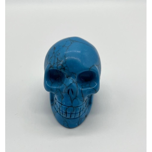 351 - A Turquoise Coloured Hand-Carved Crystal Skull Figure.
5 x 4.5cm