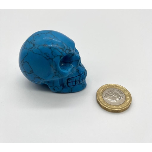 351 - A Turquoise Coloured Hand-Carved Crystal Skull Figure.
5 x 4.5cm