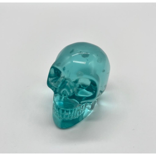 447 - A Blue Smelting Stonel Quartz Crystal Skull Figure. 5 x 4.5cm.