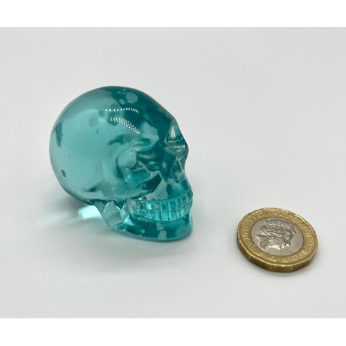 447 - A Blue Smelting Stonel Quartz Crystal Skull Figure. 5 x 4.5cm.