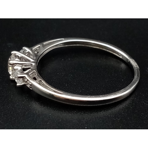 610 - A 9 K white gold , five stone ring. Size: N, weight: 1.4 g.