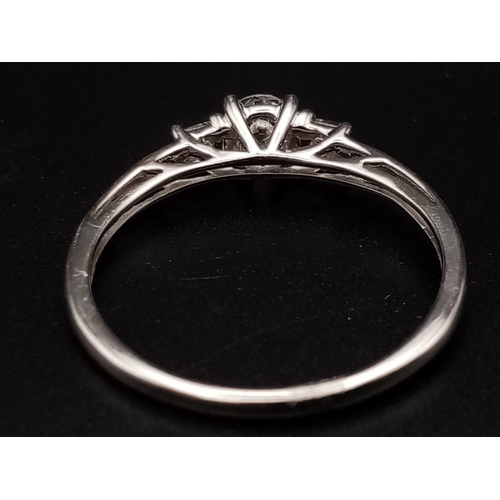 610 - A 9 K white gold , five stone ring. Size: N, weight: 1.4 g.