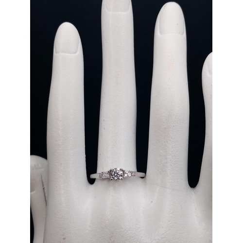 610 - A 9 K white gold , five stone ring. Size: N, weight: 1.4 g.