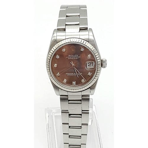 31 - A Rolex Oyster Perpetual Automatic Diamond Ladies Watch. Stainless steel strap and case - 30mm. Moth... 