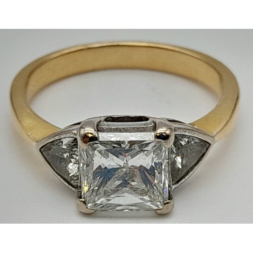 24 - An 18K Yellow Gold Diamond Solitaire Ring. Excellent quality princess cut 2ct centre stone flanked b... 