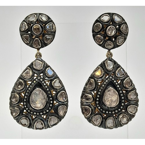 613 - A Pair of Vintage Silver and Diamond Earrings. 15mm diameter wheel leads to a large teardrop of 35mm... 