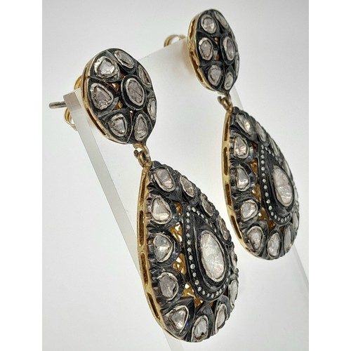 613 - A Pair of Vintage Silver and Diamond Earrings. 15mm diameter wheel leads to a large teardrop of 35mm... 