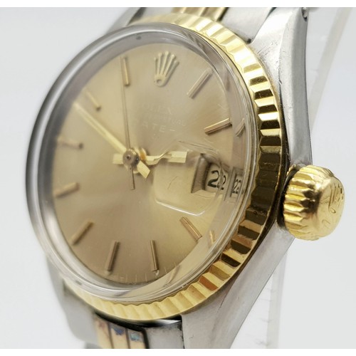 604 - A ROLEX OYSTER PERPETUAL DATE WATCH IN BI-METAL WITH GOLDTONE FACE .  25mm