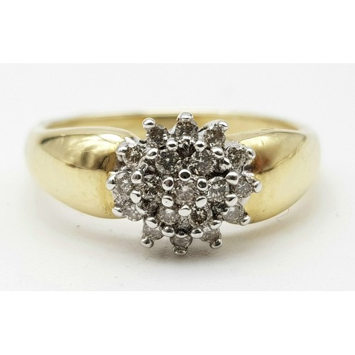 176 - A 14 K yellow gold ring with a cluster of diamonds (0.20 carats). size: K, weight: 2.9 g.