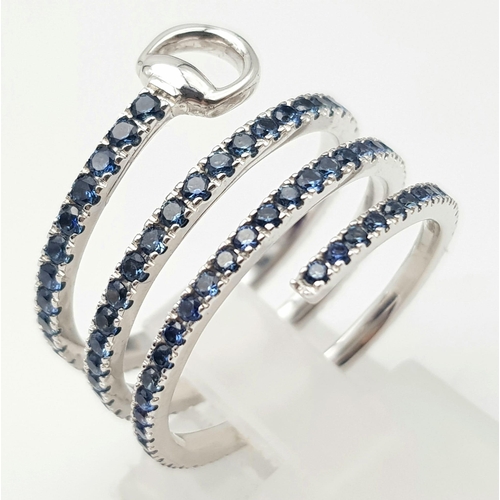 191 - An 18K White Gold and Sapphire Gucci Flora Ring. An 18k white gold spiral decorated with three circl... 