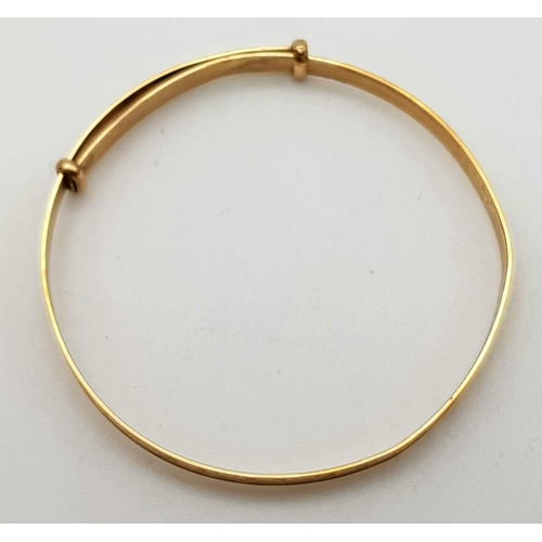 353 - A 9 K yellow gold baby bangle, weight: 1.6 g.