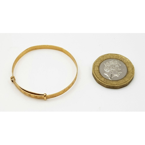 353 - A 9 K yellow gold baby bangle, weight: 1.6 g.