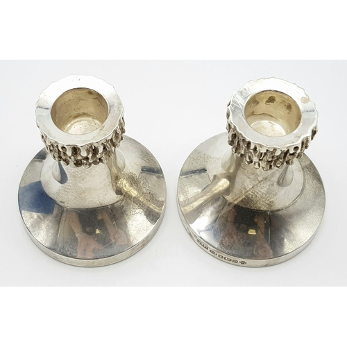 387 - Two Antique Sterling Silver Small Candle Stick Holders. 300g total weight. Weighted at base. 8cm tal... 