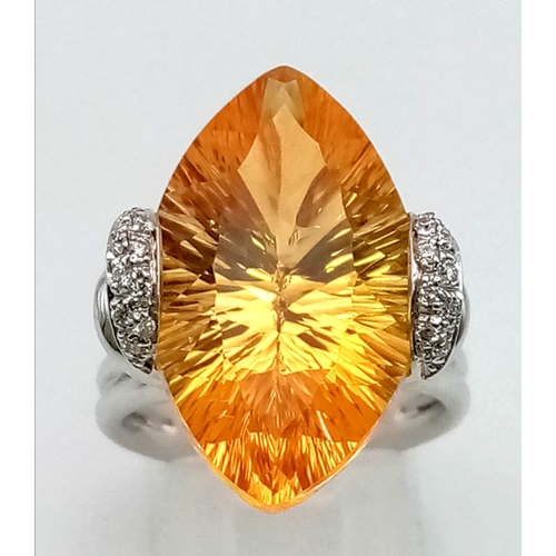 109 - A very attractive 18 K white gold ring with a beautiful large citrine and diamonds. Size: O, weight:... 