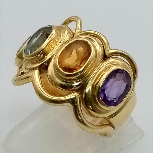 12 - AN 18K YELLOW GOLD DRESS RING WITH 4 DIFFERENT SEMI-PRECIOUS STONES .   12gms  size P