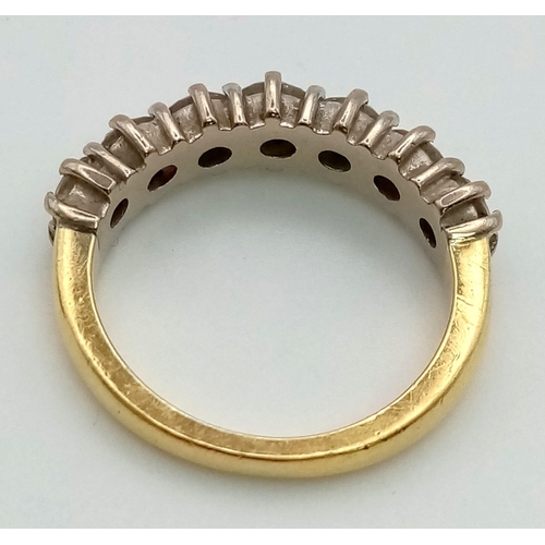 163 - An 18K Yellow Gold Diamond Half-Eternity Ring. Seven stones approx 1ct. Size K. 4.89g total weight. ... 