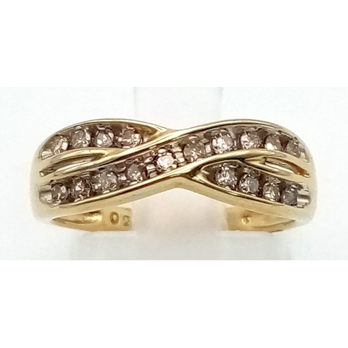 169 - A 9 K yellow gold ring with two bands of diamonds (0.25 carats) in a twist design.