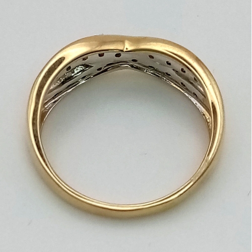 169 - A 9 K yellow gold ring with two bands of diamonds (0.25 carats) in a twist design.